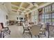 Comfortable seating in a clubhouse interior with coffered ceilings and natural light at 408 Egret Place Dr, Winter Garden, FL 34787