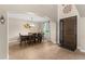Elegant dining room featuring tile floors, archway entry, and modern light fixture at 408 Egret Place Dr, Winter Garden, FL 34787