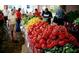 Outdoor farmer's market with a variety of fresh peppers and cucumbers at 408 Egret Place Dr, Winter Garden, FL 34787