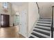 Bright foyer with tile floors, a staircase, and a view into the adjacent living area at 408 Egret Place Dr, Winter Garden, FL 34787