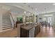 Eat-in kitchen with granite countertops, a central island, and stainless-steel appliances, great for entertaining at 408 Egret Place Dr, Winter Garden, FL 34787