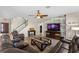 Inviting living room features a ceiling fan, and a modern accent wall for the TV at 408 Egret Place Dr, Winter Garden, FL 34787