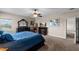 Serene main bedroom with plush carpet, ceiling fan, and ample closet space at 408 Egret Place Dr, Winter Garden, FL 34787