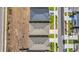 Drone's-eye view of homes displaying their roofs and surrounding neighborhood including the streets and driveways at 415 Overpool Ave, Davenport, FL 33896
