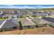 Aerial view of a residential neighborhood showcasing well-maintained homes with spacious lots in a planned community at 415 Overpool Ave, Davenport, FL 33896