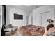 Bedroom features a comfortable bed, closet and minimalist decor for relaxation at 415 Overpool Ave, Davenport, FL 33896