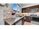 A kitchen featuring granite countertops, stainless steel appliances, and modern cabinets at 415 Overpool Ave, Davenport, FL 33896