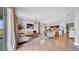 Open living space with tile flooring, neutral décor, and an island leading to an open concept kitchen at 415 Overpool Ave, Davenport, FL 33896