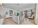 Bright living room featuring a modern chandelier, tile floors, and large sliding glass doors for seamless indoor-outdoor living at 415 Overpool Ave, Davenport, FL 33896