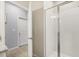 Bathroom featuring a glass enclosed shower and a view of the hallway at 449 Halter Dr, Apopka, FL 32712