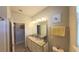 Bathroom featuring double sinks and granite countertops, offering a clean and well-lit space at 449 Halter Dr, Apopka, FL 32712
