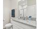 Bathroom with a vanity featuring a granite countertop and a toilet at 449 Halter Dr, Apopka, FL 32712