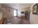 Cozy bedroom with wooden bed frame, bookshelf, TV, and window offering natural light at 449 Halter Dr, Apopka, FL 32712