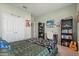 Well-lit bedroom features a large bed, workspace, and ample storage at 449 Halter Dr, Apopka, FL 32712