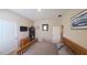 Bedroom with wooden bed frame, desk, TV, and a window that brings in natural light at 449 Halter Dr, Apopka, FL 32712