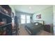 Bright bedroom with a comfortable bed, desk, and ample storage space, perfect for a relaxing retreat at 449 Halter Dr, Apopka, FL 32712