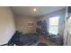 Bedroom with a bed, desk, TV, bookshelf and a window providing natural light at 449 Halter Dr, Apopka, FL 32712
