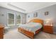 Comfortable bedroom featuring carpet, neutral walls, wood furniture, and natural light at 449 Halter Dr, Apopka, FL 32712