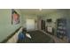 Large, cozy bedroom with decorative touches, a desk, and ample storage space, offering a comfortable living space at 449 Halter Dr, Apopka, FL 32712