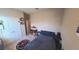 Bedroom with a bed, a desk, and laminate flooring at 449 Halter Dr, Apopka, FL 32712