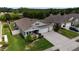 An elevated view of a lovely single-Gathering home featuring a three-car garage, a well-kept yard, and a covered entryway at 449 Halter Dr, Apopka, FL 32712