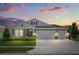Charming single-Gathering home with a well-manicured lawn and a three-car garage at 449 Halter Dr, Apopka, FL 32712