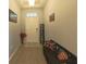 Inviting foyer featuring wood flooring, a welcome sign, and decorative pillows on a bench at 449 Halter Dr, Apopka, FL 32712