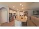 Open kitchen featuring stainless steel appliances, granite countertops and a breakfast bar with seating at 449 Halter Dr, Apopka, FL 32712