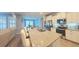 Bright eat-in kitchen with white cabinets, granite countertops, stainless appliances, and breakfast bar at 449 Halter Dr, Apopka, FL 32712
