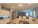 Kitchen with island, granite countertops, stainless appliances and open view to the living area at 449 Halter Dr, Apopka, FL 32712