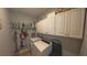 Laundry room with white cabinetry, washer, and dryer at 449 Halter Dr, Apopka, FL 32712