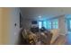Open-plan living room featuring a fireplace, shutters and comfortable seating at 449 Halter Dr, Apopka, FL 32712
