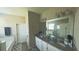 Bright bathroom with double vanity, granite countertop, and separate bathtub at 449 Halter Dr, Apopka, FL 32712