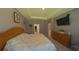 Spacious main bedroom showcasing a large bed, tray ceiling, and ample natural light at 449 Halter Dr, Apopka, FL 32712