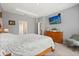 Spacious main bedroom features a tray ceiling, neutral walls, carpet, and plenty of natural light at 449 Halter Dr, Apopka, FL 32712