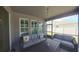 Comfortable screened patio with outdoor seating, ideal for relaxation and entertainment at 449 Halter Dr, Apopka, FL 32712