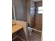 Bathroom featuring tiled walk-in shower, tiled floors and a vanity with large mirror at 5005 Lindsay Ct, Orlando, FL 32821