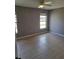 Bedroom with neutral walls, tiled flooring, ceiling fan and view of neighborhood at 5005 Lindsay Ct, Orlando, FL 32821