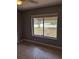 Bedroom with neutral walls, tiled flooring and a view of neighborhood at 5005 Lindsay Ct, Orlando, FL 32821
