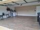 Spacious garage with washer, dryer, water heater, and porcelain wood-look tile at 5005 Lindsay Ct, Orlando, FL 32821