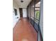 Screened porch with tiled flooring and a view of front yard at 5005 Lindsay Ct, Orlando, FL 32821