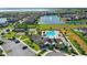 Aerial view of the Lakeshore community pool and playground with pond at 5006 Caspian St, St Cloud, FL 34771