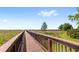 Scenic wooden boardwalk offering a tranquil nature walk through lush greenery at 5006 Caspian St, St Cloud, FL 34771