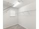 Walk-in closet with upper shelving for storage at 5006 Caspian St, St Cloud, FL 34771