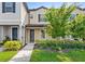 Inviting home exterior with a well-kept lawn and a front door with a covered porch at 5006 Caspian St, St Cloud, FL 34771