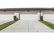 Exterior shot of multiple attached garages, offering convenient parking and storage at 5006 Caspian St, St Cloud, FL 34771