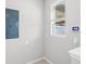 Bright mudroom with security system, tile floors and natural light from a window at 5006 Caspian St, St Cloud, FL 34771
