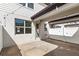 Cozy outdoor patio with pavers, string lights, and privacy fence, perfect for entertaining and relaxation at 5006 Caspian St, St Cloud, FL 34771