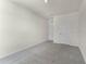 Bedroom featuring neutral carpet and two interior doors at 5217 Marshelder St, Apopka, FL 32712