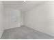 Minimalist bedroom featuring gray carpet and two white doors at 5217 Marshelder St, Apopka, FL 32712